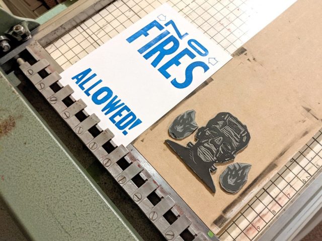 Line-o-Scribe press with linocut and wood type