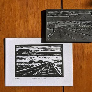 Linocut block print depicting Utah State Route 128 near Moab and Arches National Park